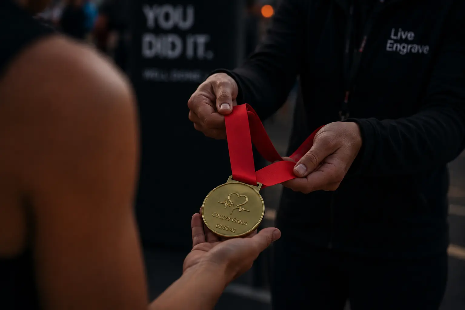 Guest receiving a personalised medal at a live event